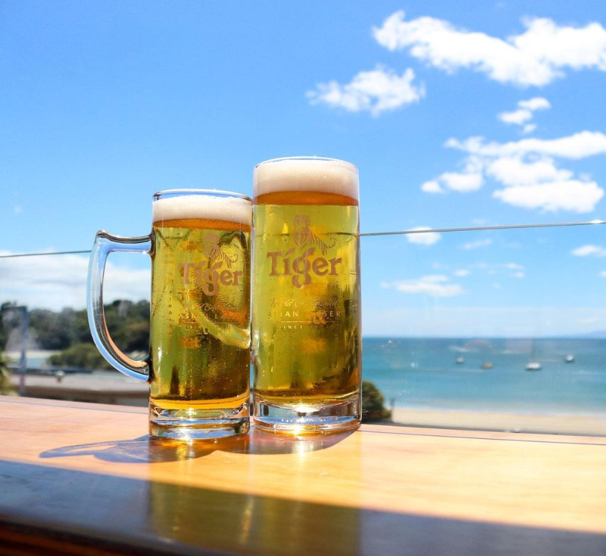 Beer on deck overlooking ocean